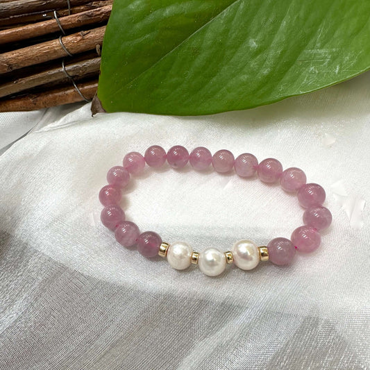 Rose Quartz Pearl Bracelet on white cloth – single bracelet detailed shot