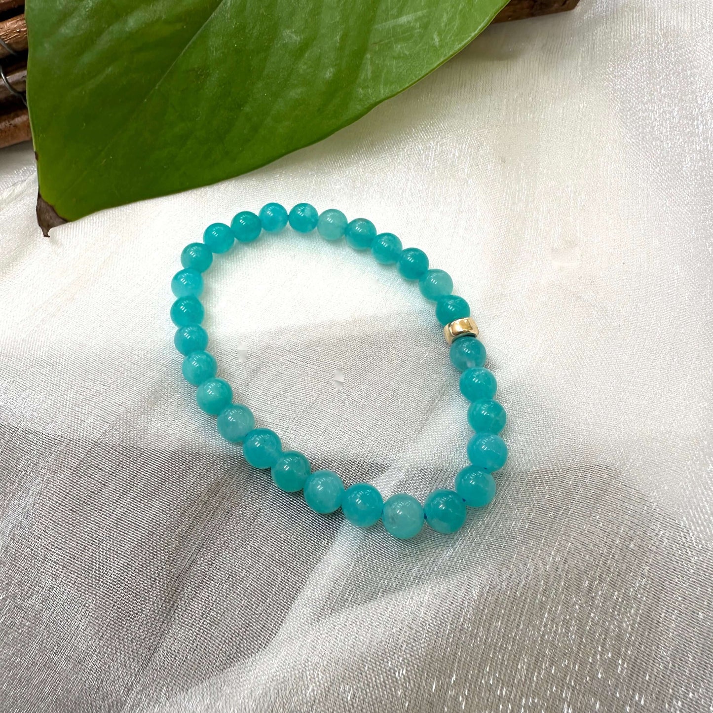 Blue Amazonite Bracelet displayed on white cloth – detailed product close-up