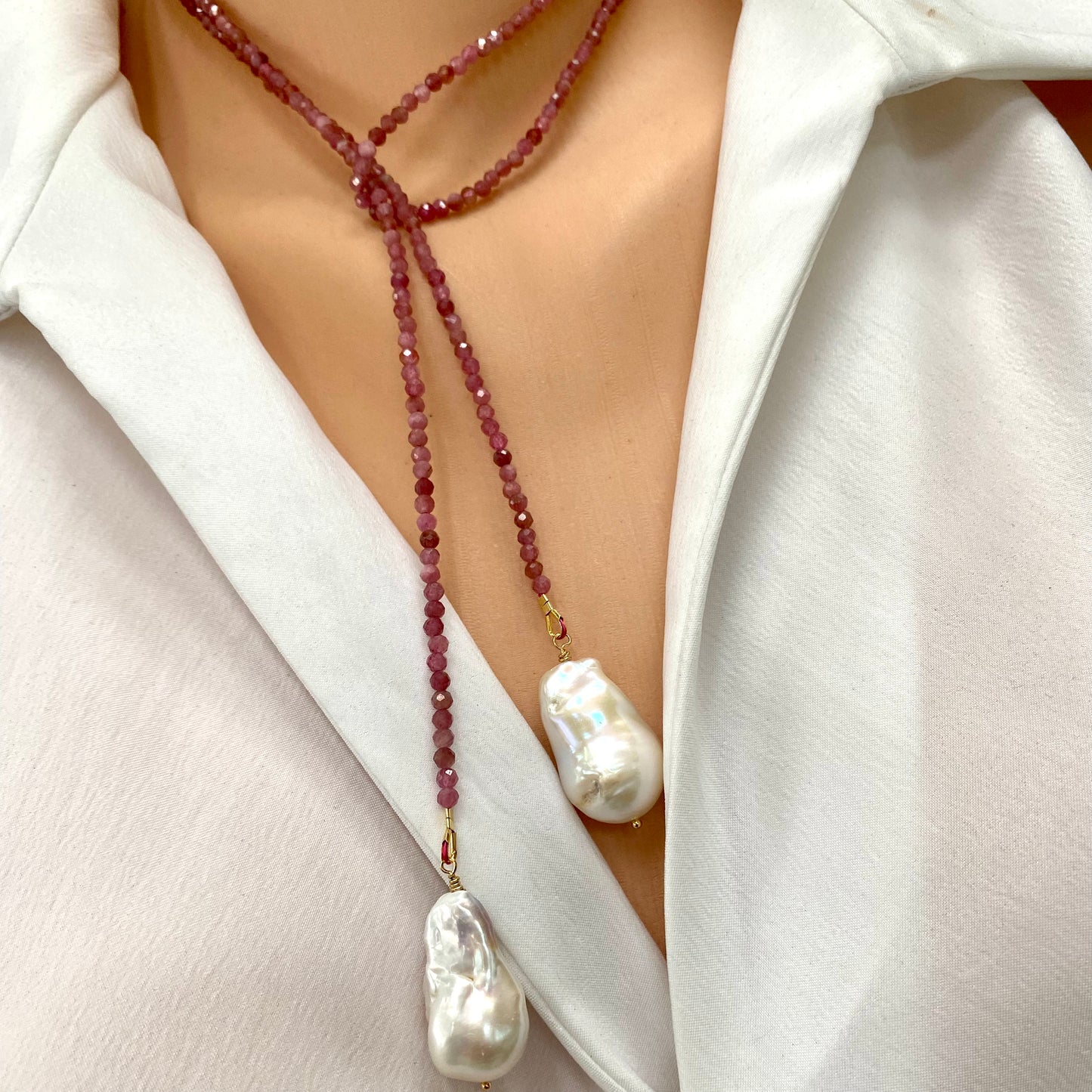 Pink Tourmaline Pearl Lariat Necklace featuring pink tourmaline beads and white baroque pearls, worn elegantly.