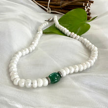 Load image into Gallery viewer, white silverite candy necklace with an emerald in the middle adorned with 2 diamonds pave rings