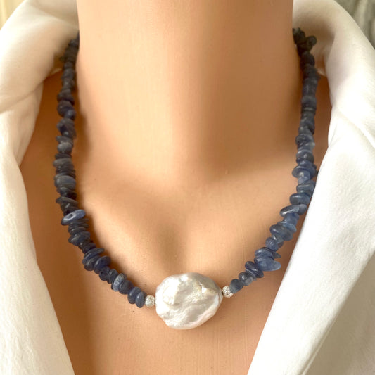 Blue kyanite pearl necklace on mannequin showing baroque pearl centerpiece