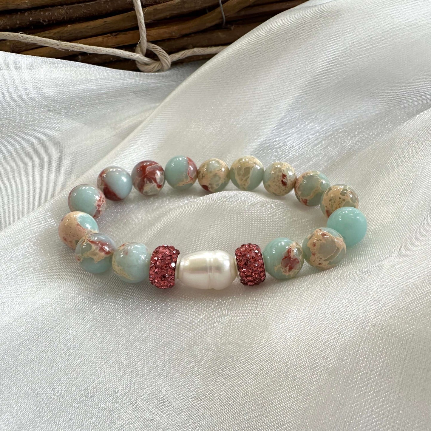 Blue opal jasper bracelet displayed on white cloth background