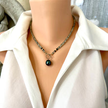 Charger l'image dans la galerie, This necklace features a delicate chain of soft, translucent faceted green Prehnite rondelle beads, beautifully complemented by a striking Tahitian baroque pearl as the centerpiece pending from a cold filled toggle clasp. 18"inches long