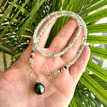 Charger l'image dans la galerie, This necklace features a delicate chain of soft, translucent faceted green Prehnite rondelle beads, beautifully complemented by a striking Tahitian baroque pearl as the centerpiece pending from a cold filled toggle clasp. 18"inches long