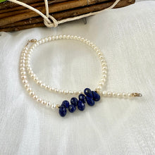 Carica l'immagine nel visualizzatore di Gallery, double wrap bracelet, featuring two strands of shimmering freshwater pearls beautifully accented with deep blue Lapis Lazuli teardrop briolettes, Gold filled details.