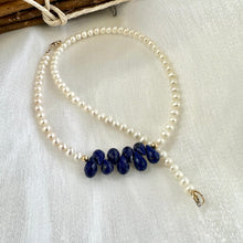 Carica l'immagine nel visualizzatore di Gallery, double wrap bracelet, featuring two strands of shimmering freshwater pearls beautifully accented with deep blue Lapis Lazuli teardrop briolettes, Gold filled details.