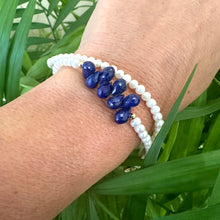 Carica l'immagine nel visualizzatore di Gallery, double wrap bracelet, featuring two strands of shimmering freshwater pearls beautifully accented with deep blue Lapis Lazuli teardrop briolettes, Gold filled details.