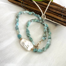 Cargar imagen en el visor de la galería, Fall in love with the soothing blues of Larimar and the timeless elegance of baroque pearls! This necklace features dreamy, ocean-inspired Larimar gemstones nuggets, perfectly complemented by the organic beauty of a stunning baroque pearl, 18 inches