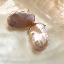 Carica l'immagine nel visualizzatore di Gallery, Golden pink rectangle baroque pearl stud earrings displayed on yellow luminescent pearl background, designed and handmade in Canada.