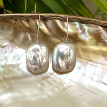 Load image into Gallery viewer, White freshwater pearl drop earrings rhodium-plated silver detailed view against leaf backdrop, elegant handmade jewelry from Canada.