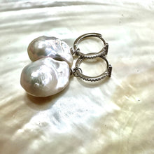 Cargar imagen en el visor de la galería, White Baroque Pearl Earrings – silver pair on white pearl shell backdrop