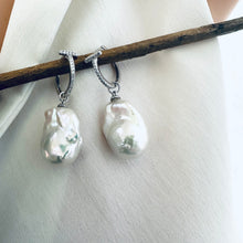 Cargar imagen en el visor de la galería, White Baroque Pearl Earrings – silver close-up against white cloth backdrop.