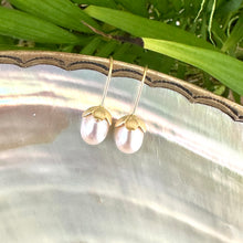 Cargar imagen en el visor de la galería, Rice Pearl Earrings – gold pair on pearl shell and green leaf backdrop