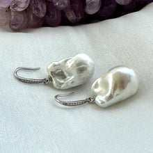 Charger l'image dans la galerie, White baroque pearl bridal earrings placed on white cloth table, sterling silver CZ pavé hooks handmade in Canada.