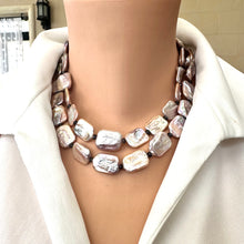 Load image into Gallery viewer, Front view of Statement Pearl Necklace showcasing purple pink pearls and navy iolite gemstones with gold magnetic clasp.