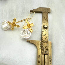 Carica l'immagine nel visualizzatore di Gallery, Keshi Pearl Earring showing full 50 mm drop length measured against ruler on white background for scale.