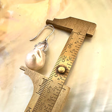 Charger l'image dans la galerie, Close-up of white baroque pearl drop earrings measured against ruler on white pearl backdrop – handmade in Canada