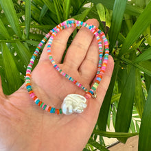 Load image into Gallery viewer, Close-up of opal and baroque pearl necklace in natural light against leaves