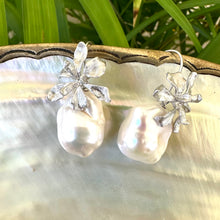 Charger l'image dans la galerie, Silver baroque pearl drop earrings on white pearl and green leaf background