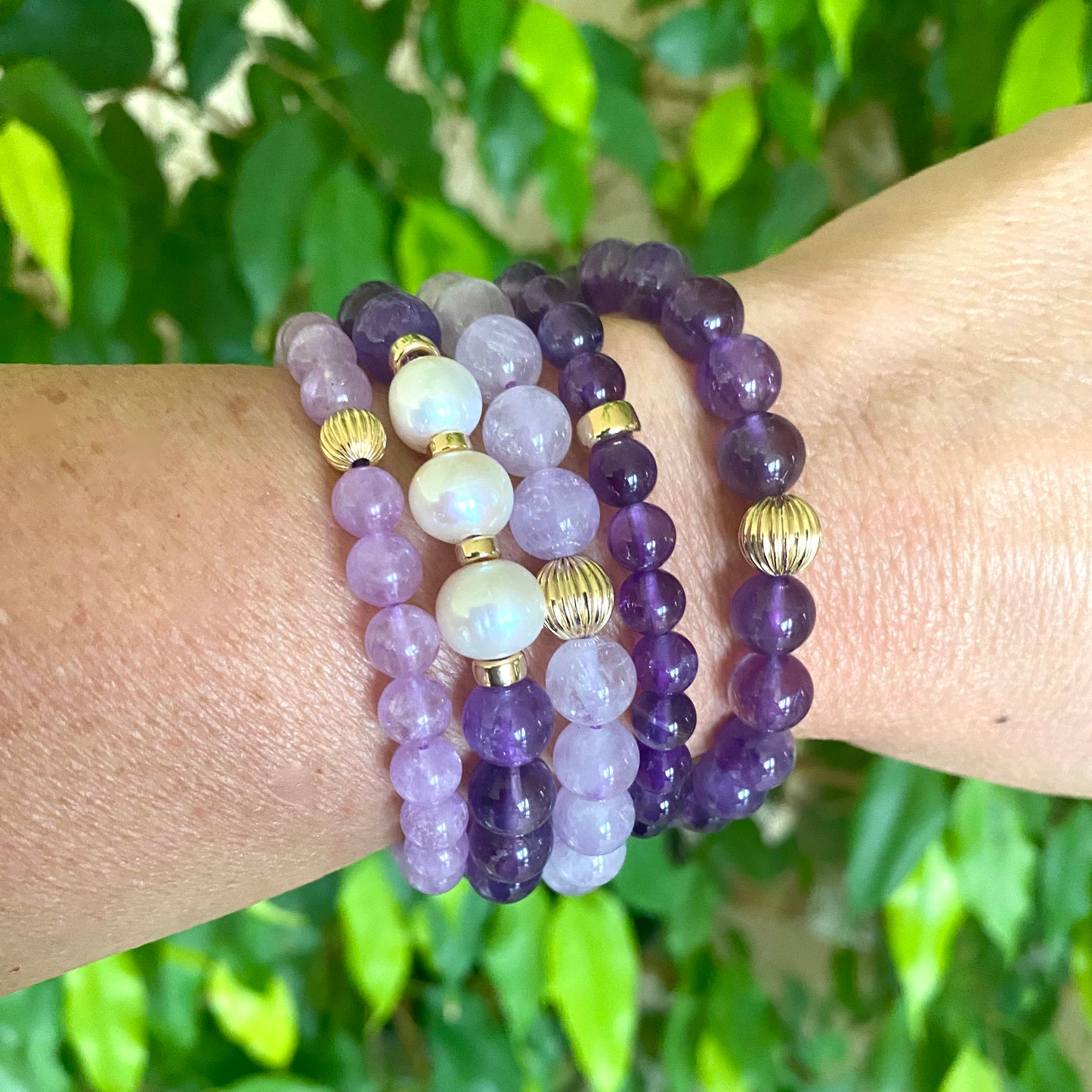 Amethyst Pearl Bracelet paired with mixed gemstone bracelets on wrist – lifestyle close-up