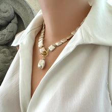 Carica l'immagine nel visualizzatore di Gallery, Golden baroque pearl toggle necklace on mannequin side view — handcrafted luminous pearl jewelry by Loulia Pearl Jewelry