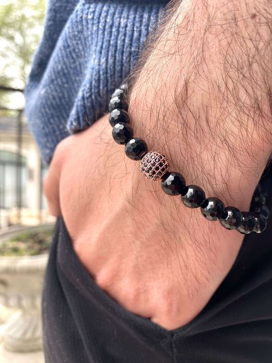 Black Onyx Mens Bracelet worn on wrist with rose gold accents showcasing its elegance and craftsmanship.