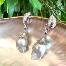 Lade das Bild in den Galerie-Viewer, Leaf Design Baroque Pearl Earrings photographed against green leaf background — botanical sterling silver jewelry by Loulia Pearl Jewelry