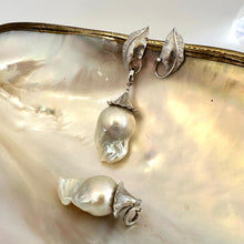 Lade das Bild in den Galerie-Viewer, Close-up of Leaf Design Baroque Pearl Earrings on white pearl backdrop — sterling silver and genuine baroque pearls handcrafted by Loulia Pearl Jewelry