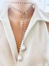 Carica l'immagine nel visualizzatore di Gallery, Versatile 40-inch Pearl Lariat Rosary Chain, designed with a stunning black rhodium-plated silver chain and freshwater small pearls for a modern, sophisticated look. Each end of the lariat features a unique white baroque pearl