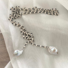 Carica l'immagine nel visualizzatore di Gallery, Versatile 40-inch Pearl Lariat Rosary Chain, designed with a stunning black rhodium-plated silver chain and freshwater small pearls for a modern, sophisticated look. Each end of the lariat features a unique white baroque pearl