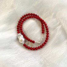 Cargar imagen en el visor de la galería, red coral and one large baroque pearl on the side of the necklace with sterling silver details, measuring 18 inches. This vibrant jewelry piece makes a thoughtful gift for her.