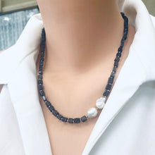 Cargar imagen en el visor de la galería, Navy Blue Iolite Rectangular Beads and 2 Baroque Pearls off centre Necklace. Finished with sterling silver details, this necklace brings together luxury and durability. The adjustable length, ranging from 19 to 20 inches, ensures a perfect fit