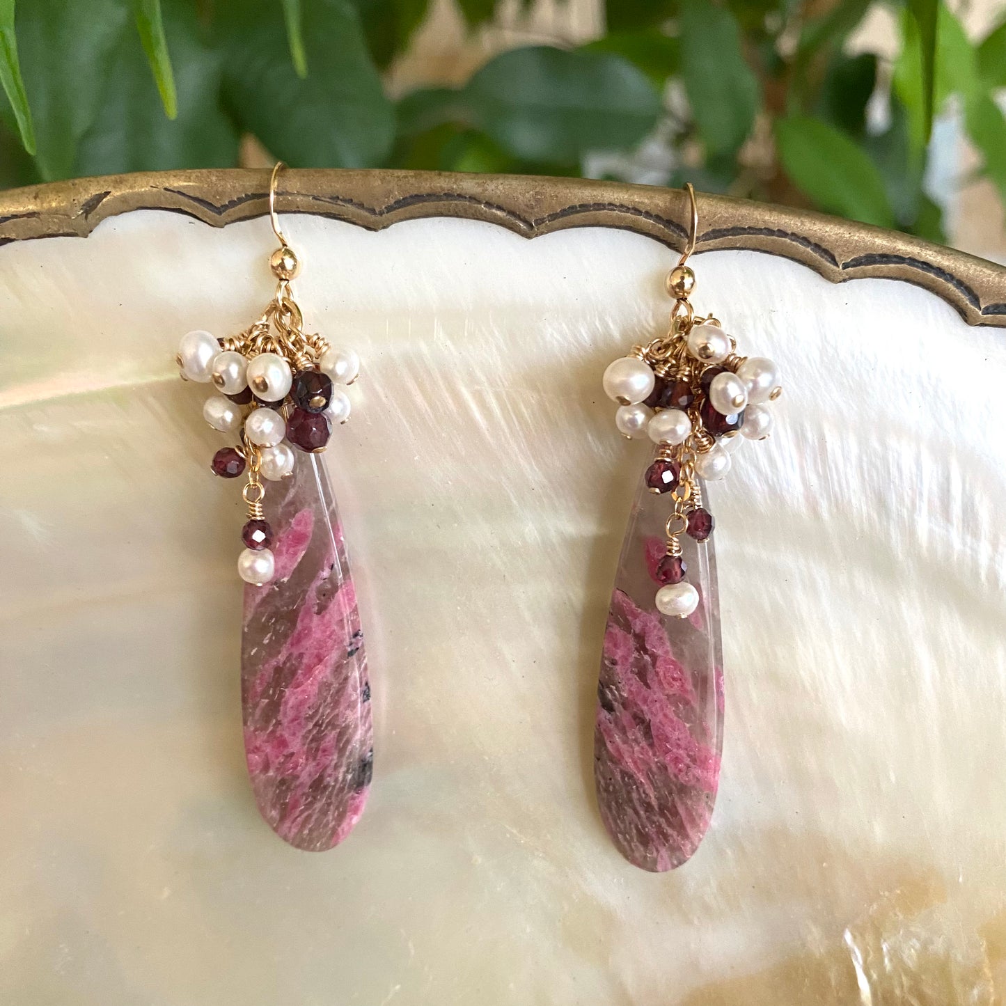 Pink rhodonite teardrop earrings with garnet and pearl on white pearl shell handmade in Canada