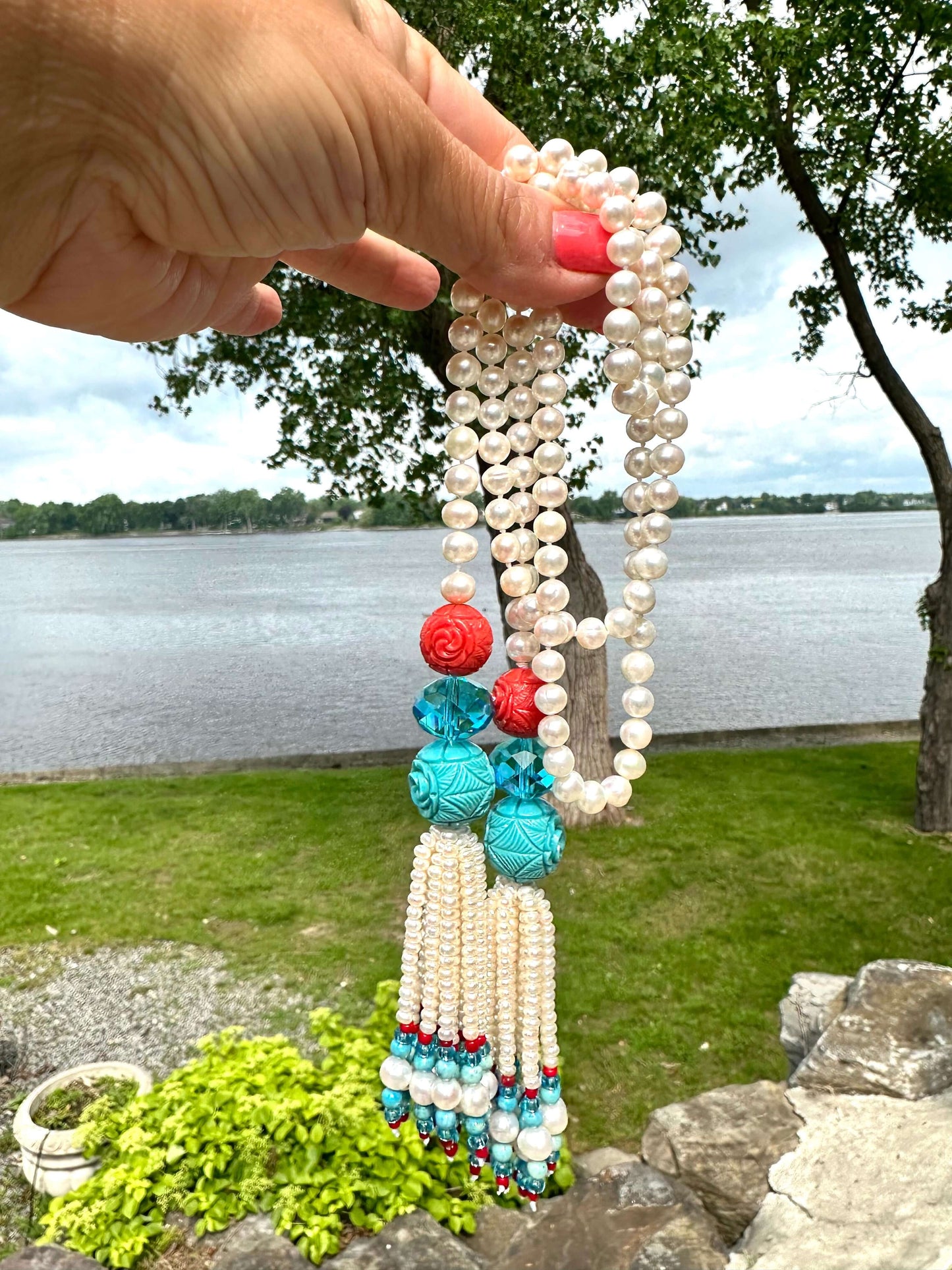 Pearl coral turquoise lariat necklace showcasing pearls, coral and turquoise beads in a romantic coastal design.