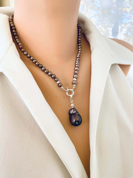 Bronze pearl necklace featuring removable brown baroque pearl pendant, displayed on mannequin with natural luster and sheen.