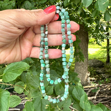 Carica l'immagine nel visualizzatore di Gallery, Emerald Pyrite Candy Necklace displayed, showcasing handcrafted design with emerald cube-cut gemstones and pyrite.