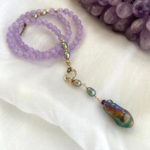 Load image into Gallery viewer, Amethyst Pearl Necklace displayed on white background beside raw amethyst gemstone.