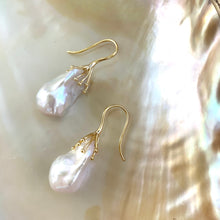 Charger l'image dans la galerie, Side angle of white baroque pearl drop earrings showing organic shape and iridescence – handmade in Canada