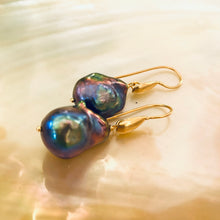 Carica l'immagine nel visualizzatore di Gallery, Handmade black baroque pearl drop earrings with gold vermeil hooks displayed on white pearl backdrop