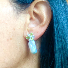 Cargar imagen en el visor de la galería, Side view of woman wearing Peridot stud earrings with baroque pearl drops