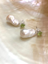 Cargar imagen en el visor de la galería, Baroque pearl drop earrings with peridot studs on white seashell background