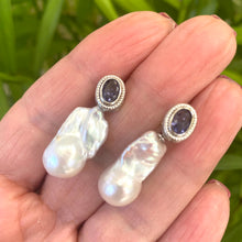 Cargar imagen en el visor de la galería, Handcrafted iolite baroque pearl drop earrings held in hand — detailed close-up of gemstone studs with removable pearls by Loulia Pearl Jewelry