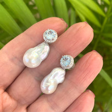 Cargar imagen en el visor de la galería, Blue topaz pearl drop earrings shown in hand for size reference, handmade in Canada