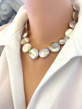 Cargar imagen en el visor de la galería, Handcrafted large coin pearl necklace side angle on mannequin, elegant design