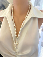 Carica l'immagine nel visualizzatore di Gallery, Baroque pearl cross pendant on long white pearl necklace, front view on mannequin.