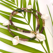 Carica l'immagine nel visualizzatore di Gallery, Handcrafted multi tourmaline and keshi pearl necklace against leaf and white background, artisan jewelry.