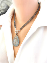Load image into Gallery viewer, Side view of mannequin wearing labradorite aquamarine pendant necklace with aquamarine gemstone pendant — refined handcrafted jewelry by Loulia Pearl Jewelry
