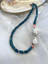 Charger l'image dans la galerie, Detailed view of blue apatite coral pearl necklace against white background — sterling silver clasp and colorful gemstone design