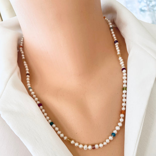 Rainbow gemstone pearl necklace worn at collarbone with delicate freshwater pearls