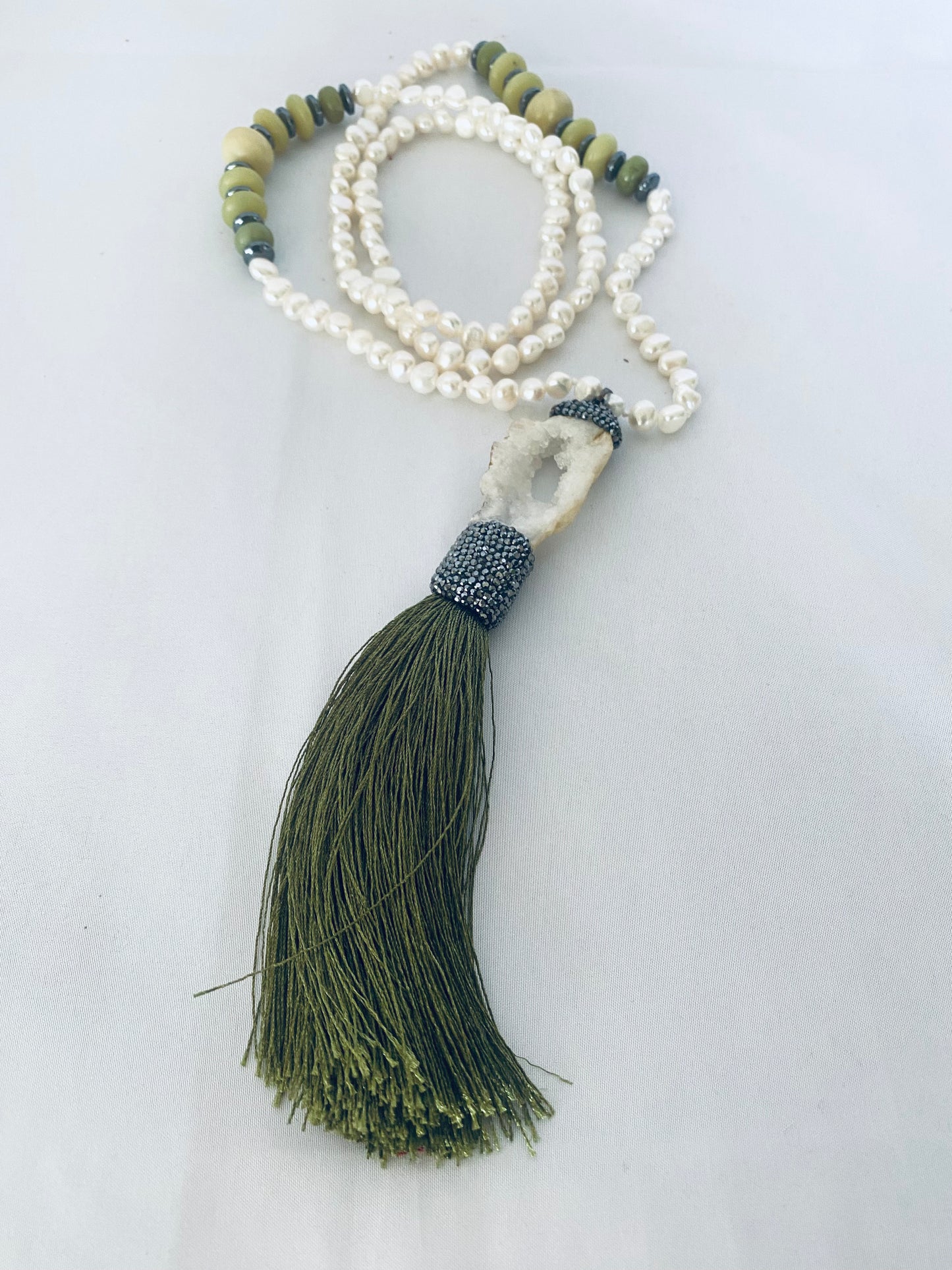 Close-up of Boho Chic Pearl Tassel Necklace — freshwater pearls, jade beads, and druzy agate pendant handcrafted by Loulia Pearl Jewelry